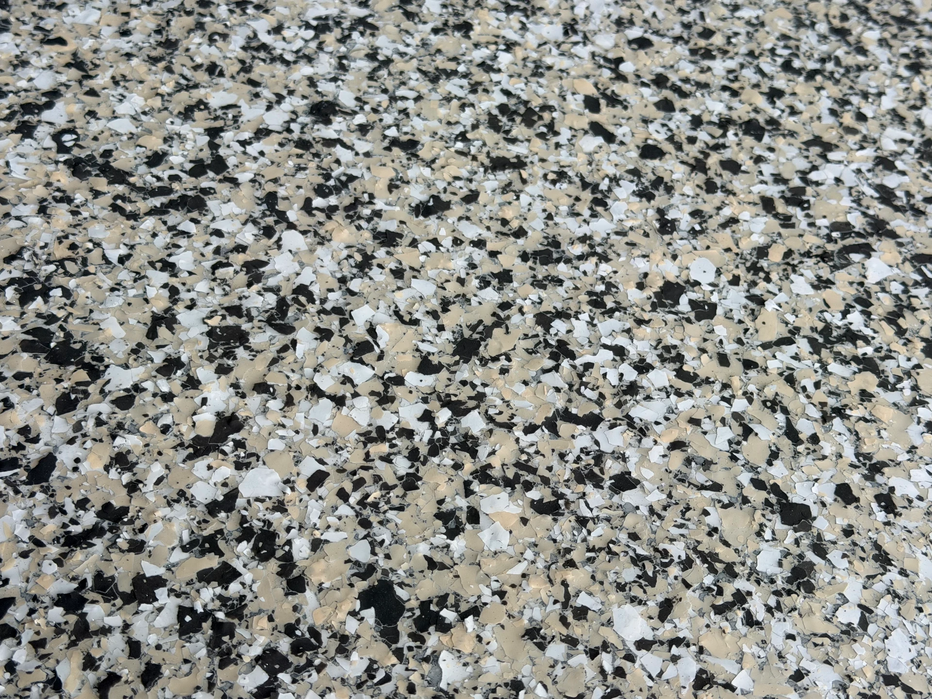 Close detail of a decorative flake epoxy floor finish